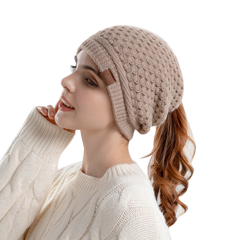 Autumn and winter warm earmuffs hat women's hat ponytail hole knitted hat European and American cross-border wool hat