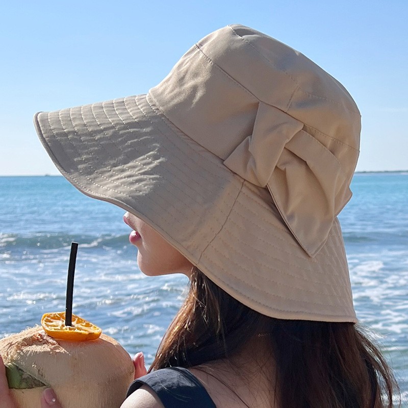 Korean style summer foldable breathable fisherman's hat for women, flattering and slimming, fashionable and versatile, with a bow for sun protection.