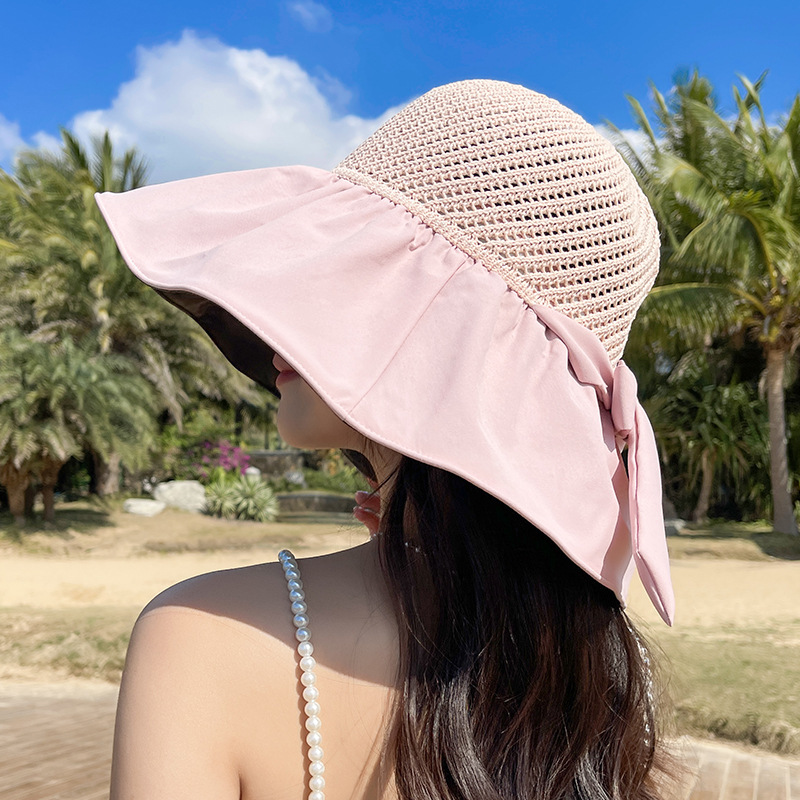 Women's sun hat, UV protection sun hat, foldable black vinyl bucket hat, face-covering, wide-brimmed sun hat for beach use.