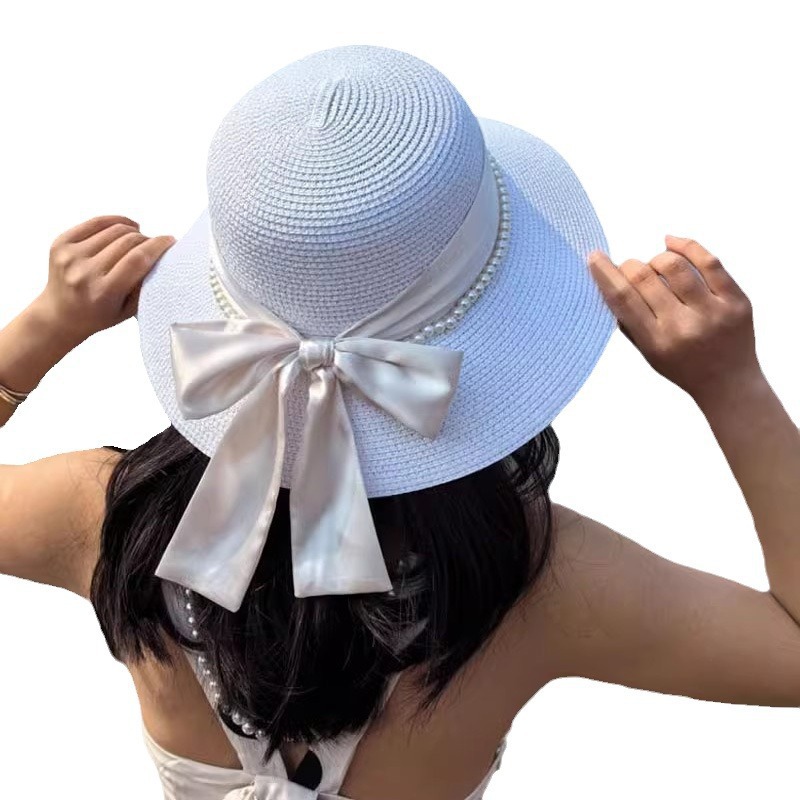 Summer Hepburn-style bow-tie beach straw hat for women, sun protection, versatile fisherman's hat, perfect for outings and UV protection.